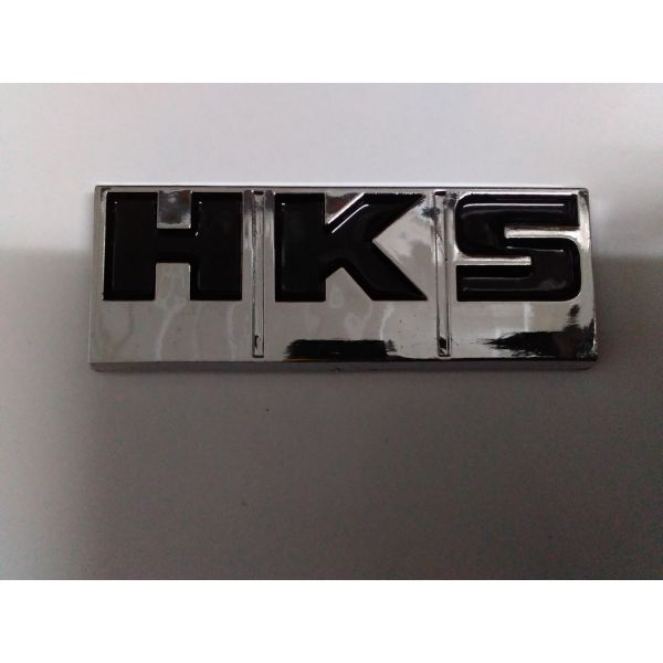 Шильдик HKS черный 6.7x2,9см